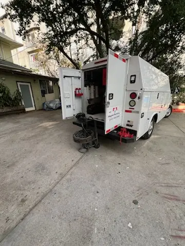 Magnet Plumbing service vehicle on-site for Grease Trap Cleaning in Maryknoll
